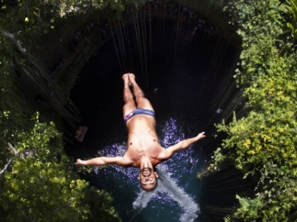 Orlando Duque of Colombia dives from the 27.25 metre platform during the second stop of the Red Bull Cliff Diving World Series at Ik Kil cenote in Chichen Itza, Yucatan, Mexico on April 10th 2011.