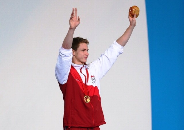 GLASGOW, SCOTLAND - JULY 25:  Benjamin Proud of England celebrates winning his gold medal during the medal ceremony for the Men's 50m Butterfly Final at Tollcross International Swimming Centre during day two of the Glasgow 2014 Commonwealth Games on July 25, 2014 in Glasgow, Scotland.  (Photo by Quinn Rooney/Getty Images)