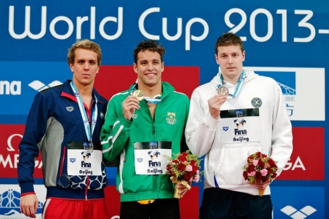 BEIJING, CHINA - NOVEMBER 14: Gold medalist Chad Le Clos (C) of South Africa, Silver medalist Thomas Shields of the United States and Bronze medalist Konrad Czerniak of Poland pose with their medals during the medalist ceremony of Fina Swimming Word Cup 2013 Men's 100m Butterfly  Final at National Aquatics Center on November 14, 2013 in Beijing, China.  (Photo by Lintao Zhang/Getty Images)