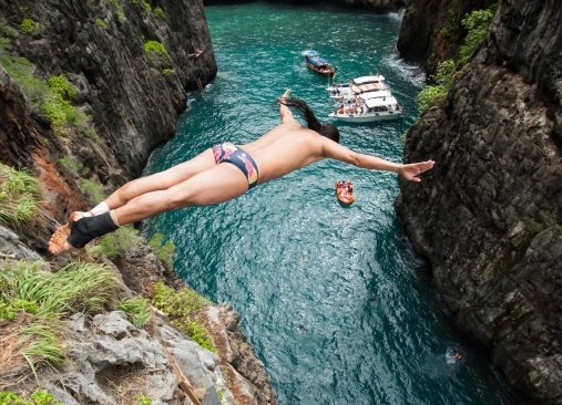 Orlando Duque of Colombia dives from a 20 metre rock at Wang Long Bay on Phi Phi Leh during the training second day of the eighth and final stop of the Red Bull Cliff Diving World Series, Krabi, Thailand on October 20th 2013. // Andreas VoglstÃ¤tter / Red Bull Cliff Diving // P-20131025-00099 // Usage for editorial use only // Please go to www.redbullcontentpool.com for further information. // 